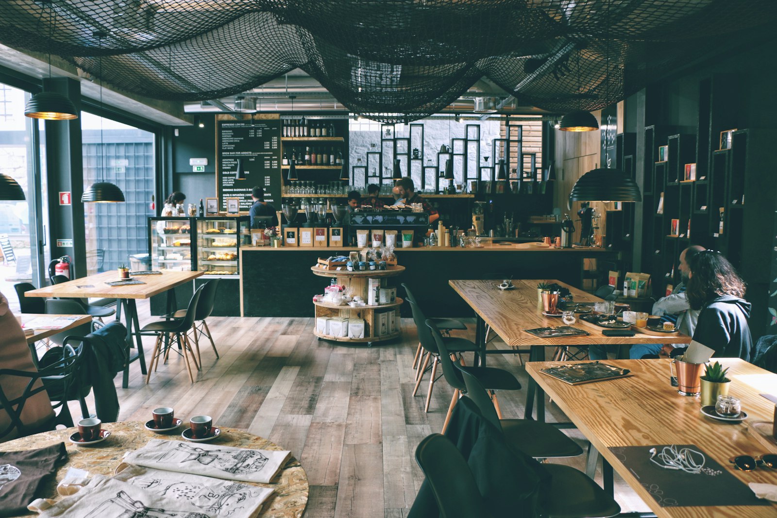 Welcoming cafe interior with warm wooden tables