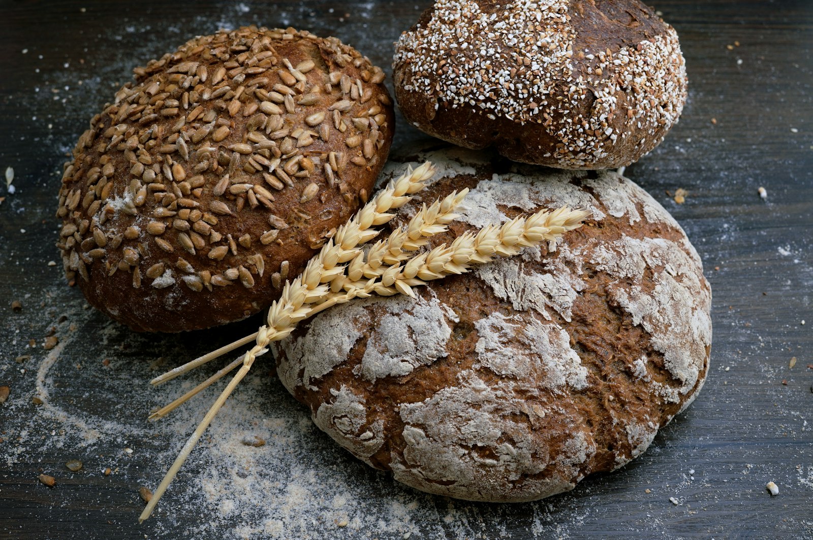 Fresh bread and pastries on a wooden board