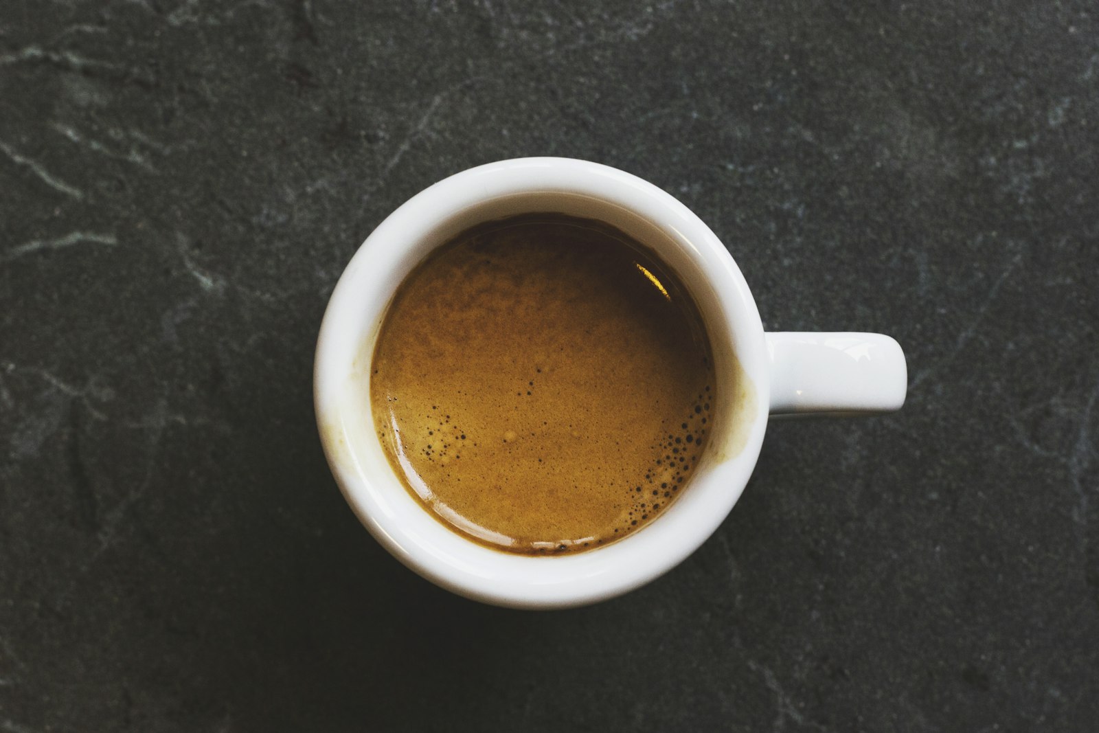 Fresh espresso in a white cup